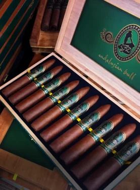 Open box of premium La Flor Dominicana cigars showing neatly arranged cigars inside.