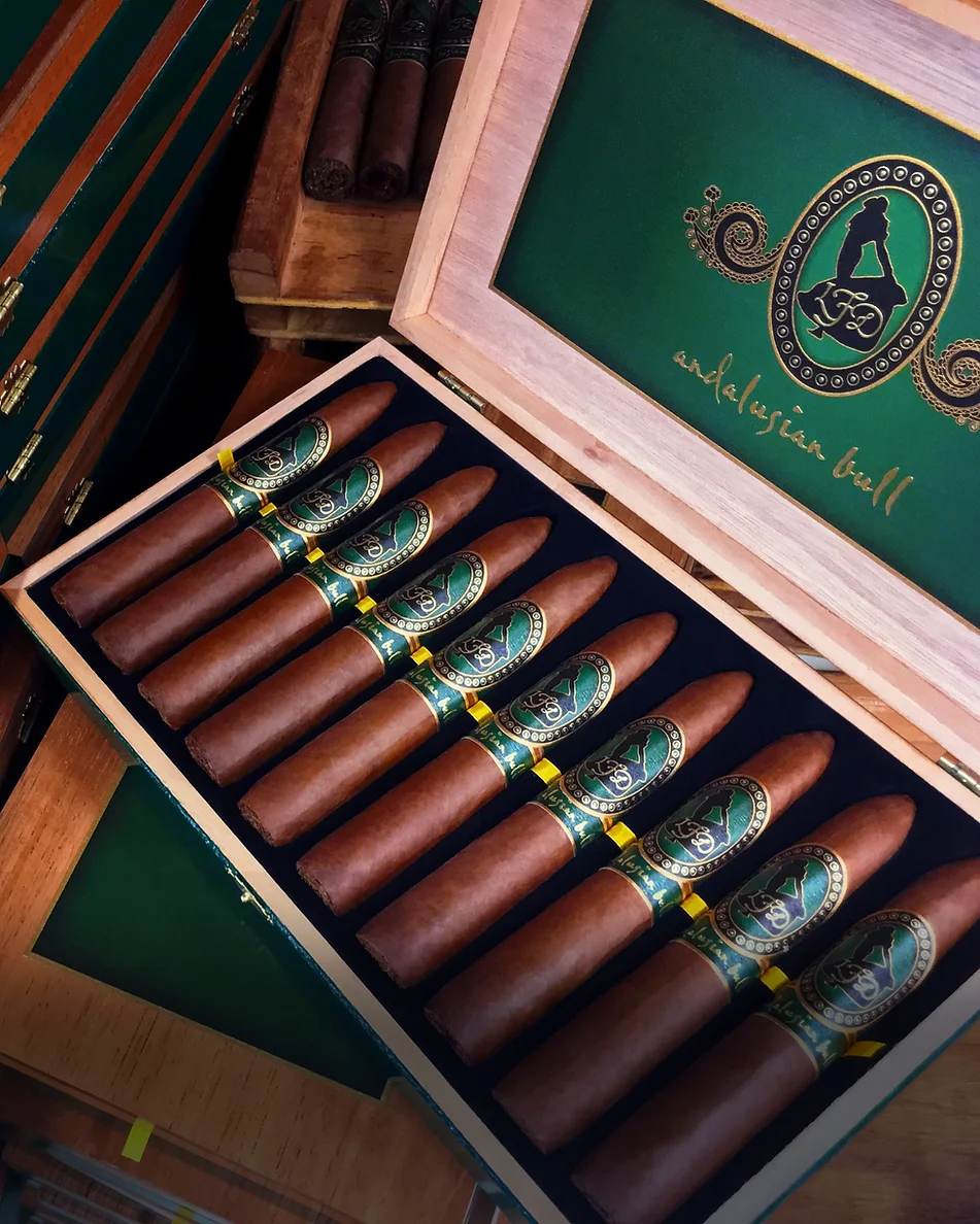Open box of premium La Flor Dominicana cigars showing neatly arranged cigars inside.