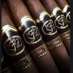 La Flor Dominicana Cameroon Cabinet cigar with a silky, reddish-brown wrapper and elegant, traditional band.