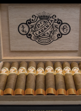 Open box of Laranja Reserva cigars with a beautiful Brazilian Laranja wrapper, neatly arranged, showcasing the elegant packaging and premium construction