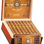 An open box of Perdomo Bourbon Barrel-Aged Connecticut cigars, showcasing light golden wrappers and elegant bands, neatly arranged inside a premium wooden box.