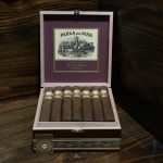 Open box of Perla Del Mar Corojo cigars neatly arranged with reddish-brown wrappers