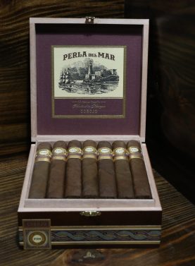 Open box of Perla Del Mar Corojo cigars neatly arranged with reddish-brown wrappers