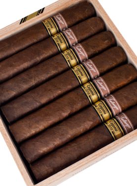 Open box of Tatuaje Cojonu 2018 cigars with rich, dark Ecuadorian Habano wrappers and bold, vintage-inspired branding.