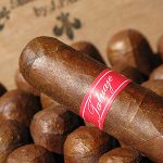 Tatuaje Havana VI cigar resting on a row of similar cigars