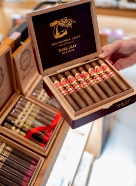 Open box of Aganorsa Leaf Rare Leaf cigars, displaying their rich, dark wrappers and flawless construction, offering a bold and complex smoking experience.