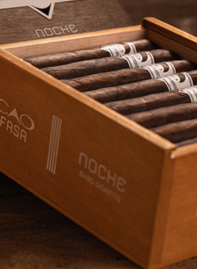 Open box of CAO Fuma Noche cigars featuring dark Brazilian Mata Fina wrappers and premium construction.