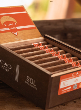 Open box of CAO Fuma Sol cigars with vibrant Ecuadorian Sumatra wrappers and sleek, vibrant banding.