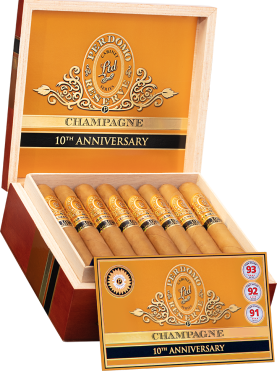 An open box of Perdomo 10th Anniversary Champagne cigars, featuring the light, smooth wrappers and gold bands, elegantly arranged inside the box.