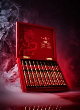 Open box of Rocky Patel Year of the Dragon cigars with elegantly arranged cigars and vibrant packaging.
