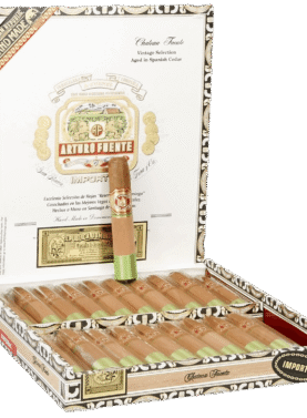 Open box of Arturo Fuente Château Fuente cigars with cedar sleeves and signature white bands, displayed in a classic wooden box.