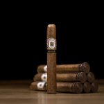 Single Gran Habano No. 3 Habano cigar with five cigars in the background