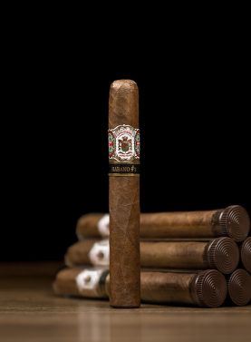 Single Gran Habano No. 3 Habano cigar with five cigars in the background