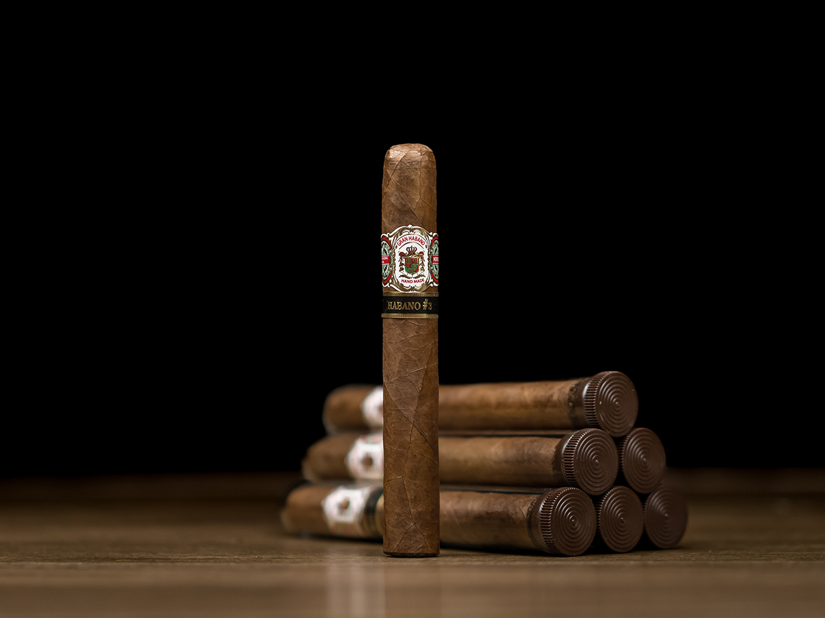 Single Gran Habano No. 3 Habano cigar with five cigars in the background