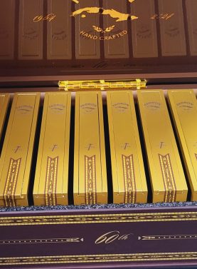 Open box of Padrón 1964 Anniversary 60th Maduro Limited Edition cigars with dark wrappers and signature bands