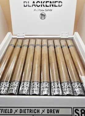 "Blackened M81 Shade cigars displayed in an open box, showcasing their smooth, creamy profile."
