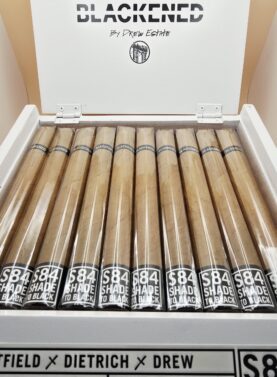 "Blackened M81 Shade cigars displayed in an open box, showcasing their smooth, creamy profile."
