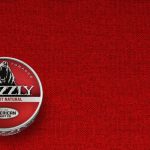 A can of Grizzly Natural Fine Cut smokeless tobacco featuring its tan-colored label and Grizzly bear logo.