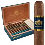 Macanudo Emissary France cigars in an open box with a single cigar positioned in front, showcasing elegant branding and craftsmanship