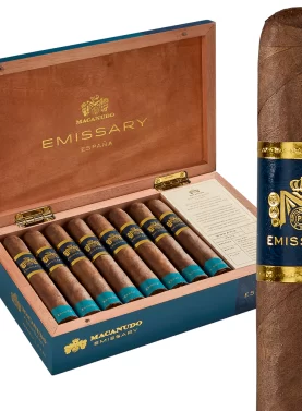 Macanudo Emissary France cigars in an open box with a single cigar positioned in front, showcasing elegant branding and craftsmanship
