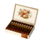 La Gloria Cubana Los Gloriosos cigar with ornate band and rich brown wrapper, displayed on a wooden surface.