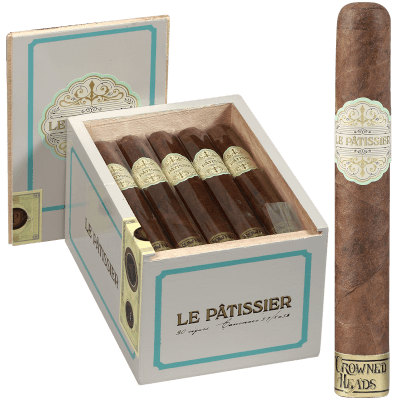 Le Pâtissier cigar standing in front of an open box filled with identical cigars