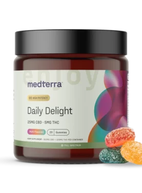 Jar of Medterra Daily Delight CBD Gummies with three gummies placed beside it to show size, shape, and texture.