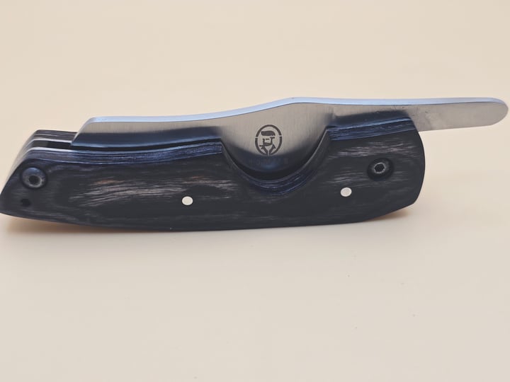 Rami's cigar knife with sleek black wood handle and stainless steel blade