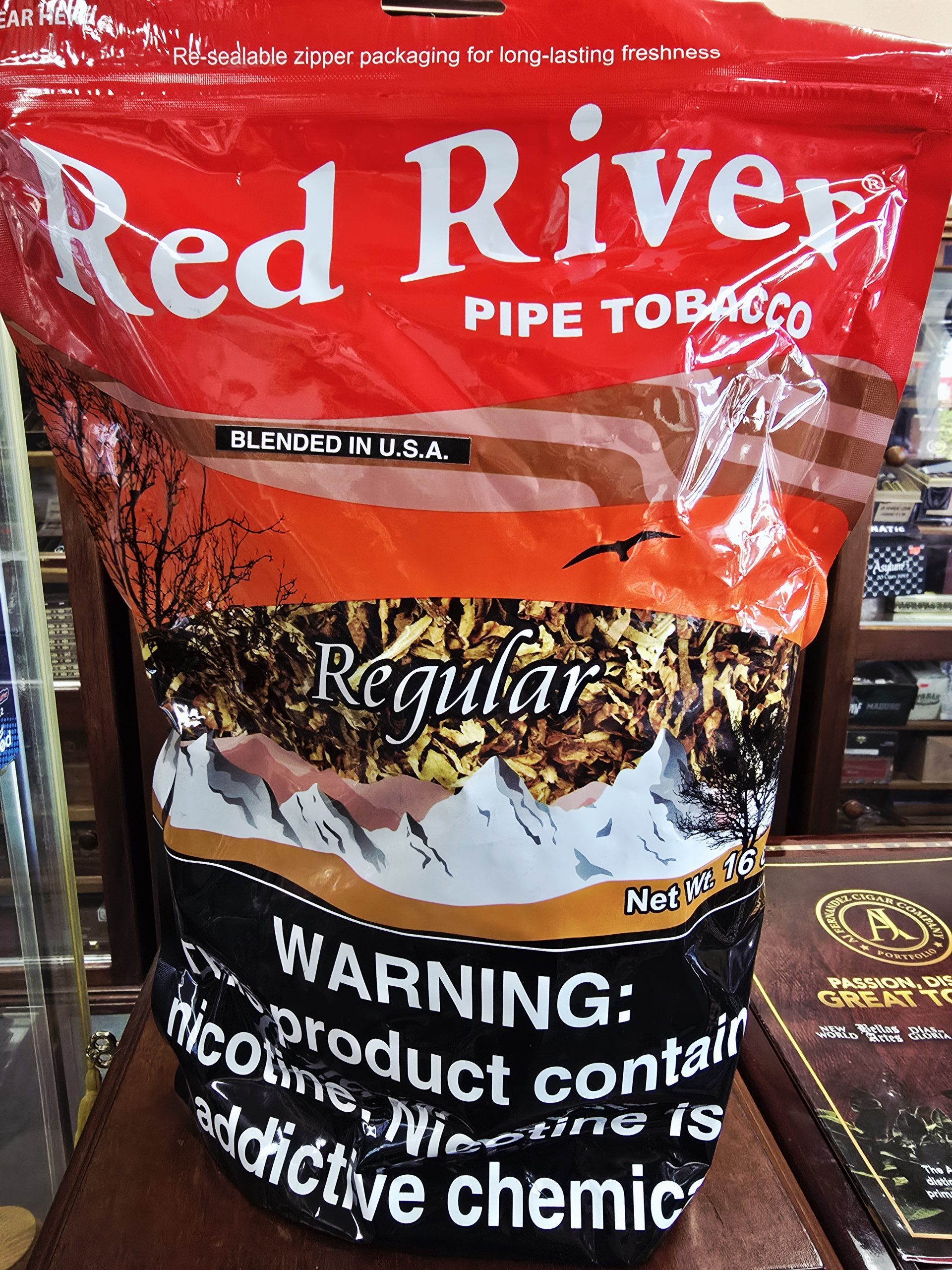 Red River Red 16 oz bag of pipe tobacco featuring bold lettering and resealable packaging.