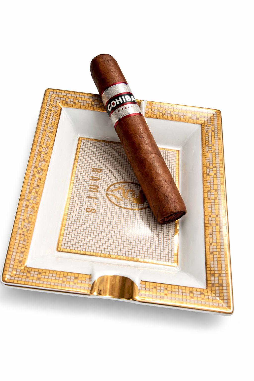 Cohiba Royale cigar on Rami’s luxury gold trim cigar ashtray with white background