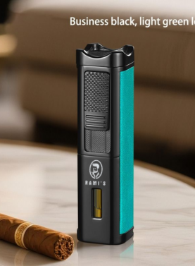 A tall, matte black Rami's Accessories executive lighter with textured light green leather siding, featuring a fuel window and the brand logo, standing on a marble table next to a cigar.
