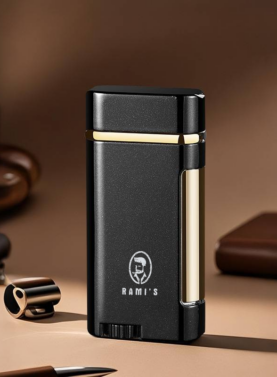 A sleek, matte Onyx Black Rami's Accessories lighter with polished gold accents, standing upright on a desk surface alongside a coffee cup and leather goods.