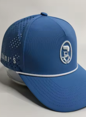 A studio product shot of a cobalt blue Rami's Apex Performance Cap, featuring a white rope trim on the brim, laser-perforated side panels for breathability, and the signature "Rami's" brand logo embroidered in white on the front.